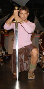 Gerald Butler in pink with a leather kilt.