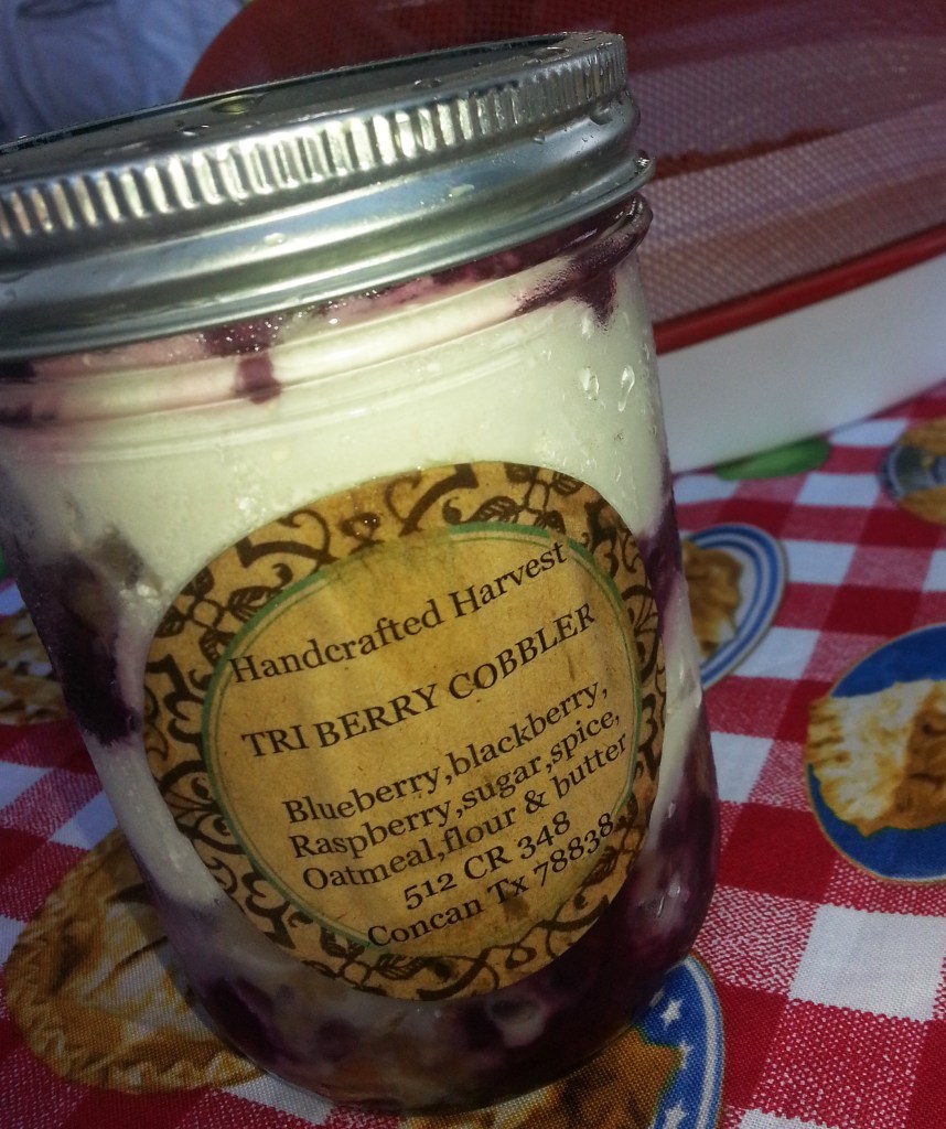 Fresh berries and cream for dessert in a jar.