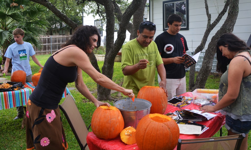 Cleaning the guts of our pumpkin