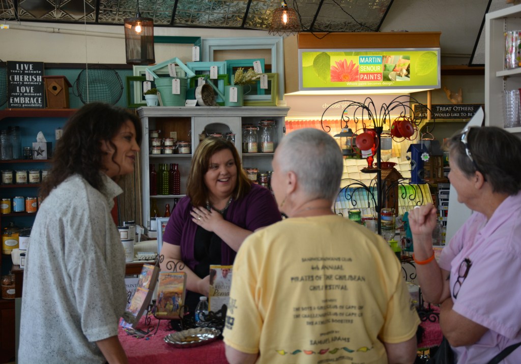 Jolene Navarro signing books at Bergmann Lumber